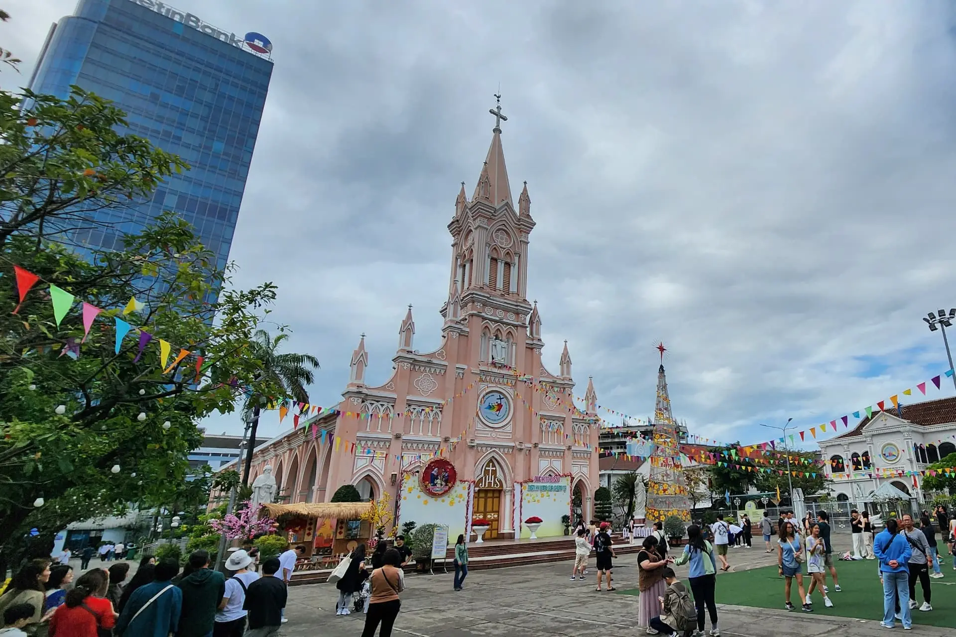 Pink facade and rooster-topped central tower of Da Nang Cathedral